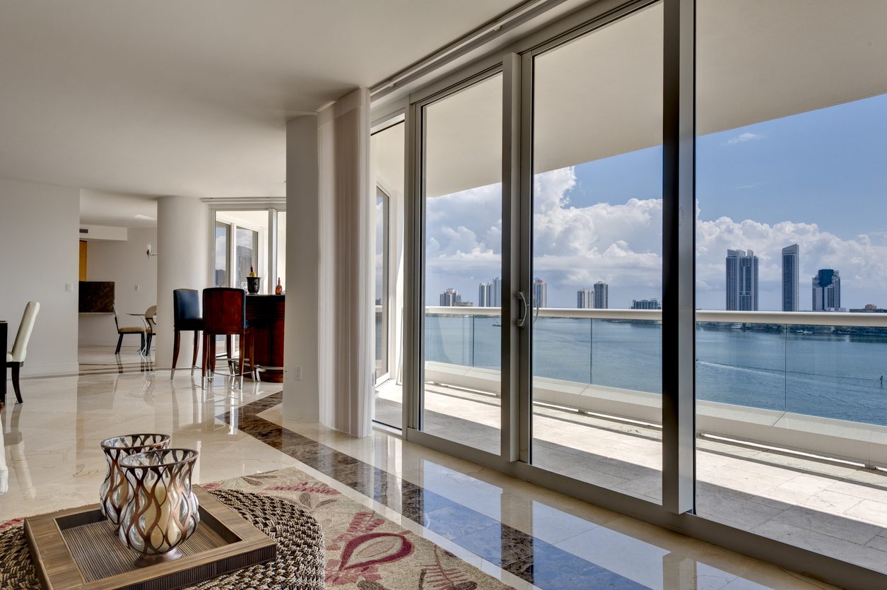 windows with overview of water in Florida - Impact Windows vs. Shutters